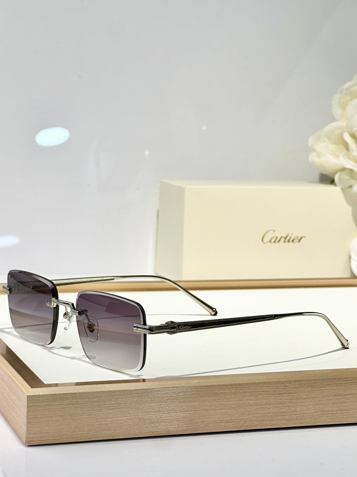 CARTIER RIMLESS SQUARE FRAME SUNGLASSES CT0610S IN METAL