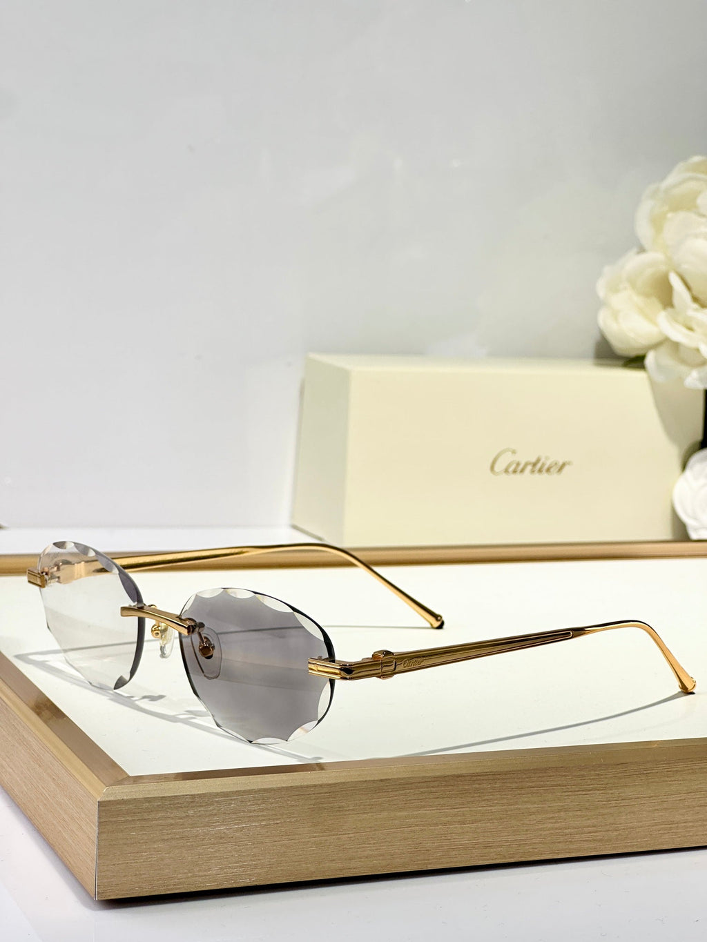 CARTIER RIMLESS ROUND FRAME SUNGLASSES CT0611S IN METAL
