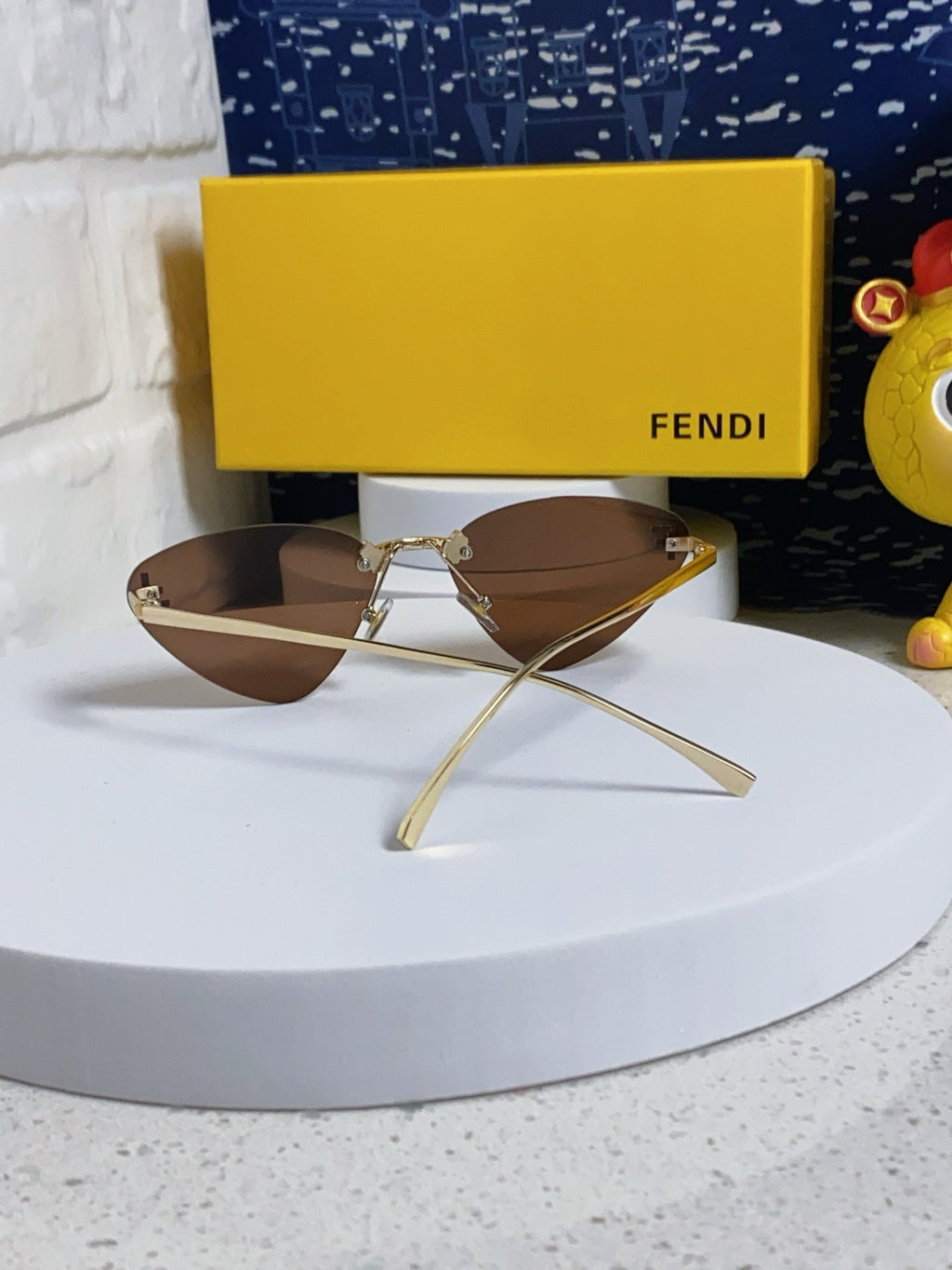 FENDI SKY RIMLESS TRIANGLE FRAME SUNGLASSES 566724 IN METAL